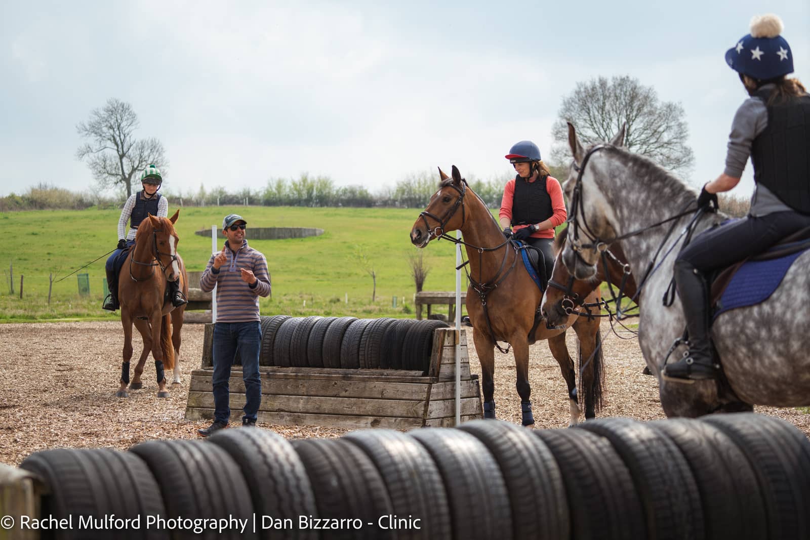 Group horse riding clinic with show jumping and polework training across the UK